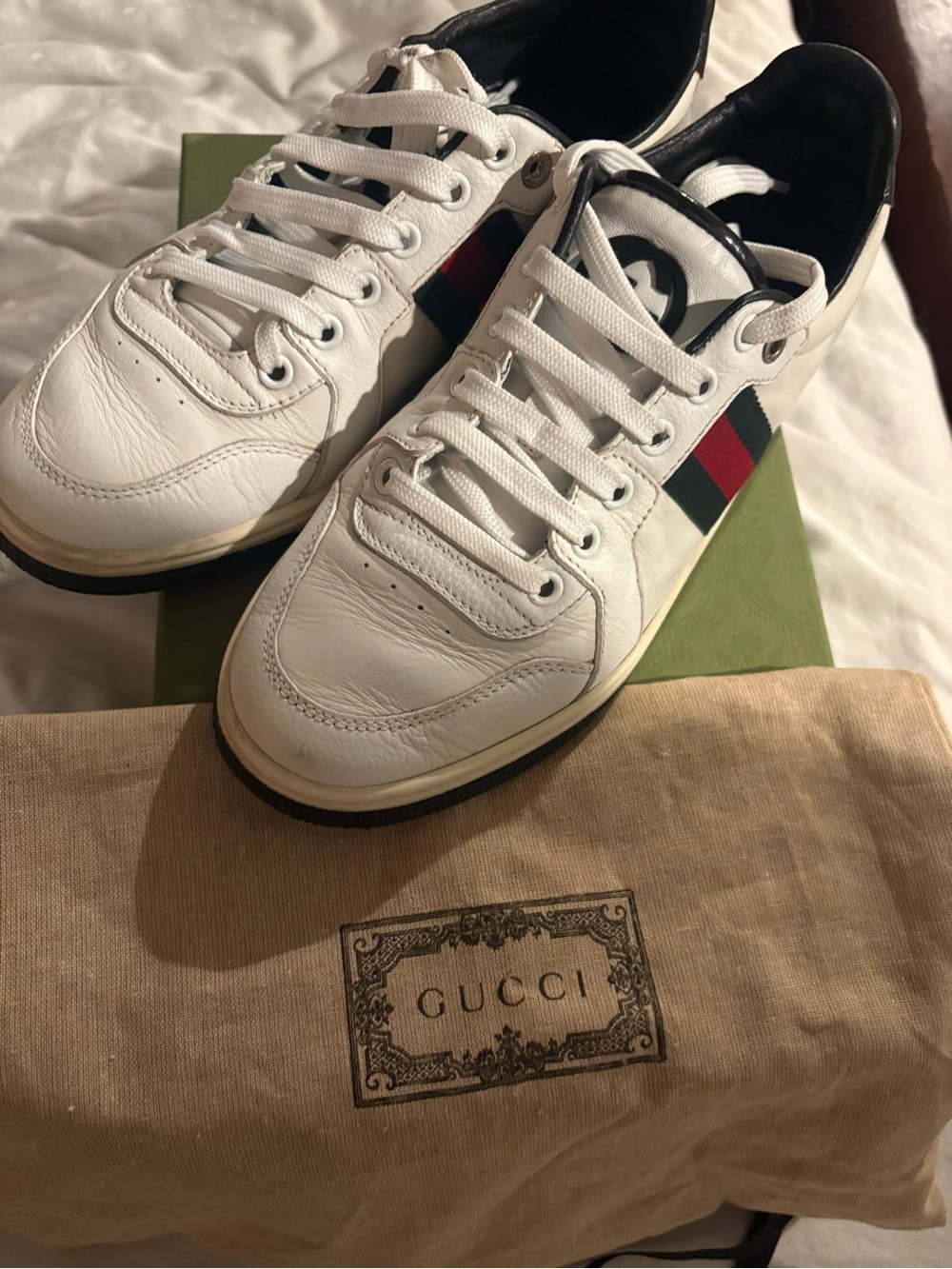 Authentic Gucci Ace leather sneakers in white with iconic green and red web stri
